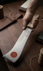 Heavy-duty South Indian darat with a curved sharp steel blade and wooden handle, designed for farming, plantation work, bush clearing, and agricultural cutting tasks.