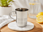 Mayur Gold Classic V-Shape Steel Mug 200ml made from premium food-grade stainless steel with a polished mirror finish and sturdy handle. Ideal for tea, coffee, milk, water, juice, and everyday use at home, office, restaurants, and hotels.