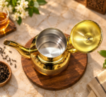 DHARA Ceylon Gold Teapot in gold finish, premium stainless steel tea server with decorative lid, curved spout and elegant handle.