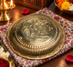 Ruliarams 12 inch golden finish Shree Ganesh embossed pooja thali with decorative traditional borders.